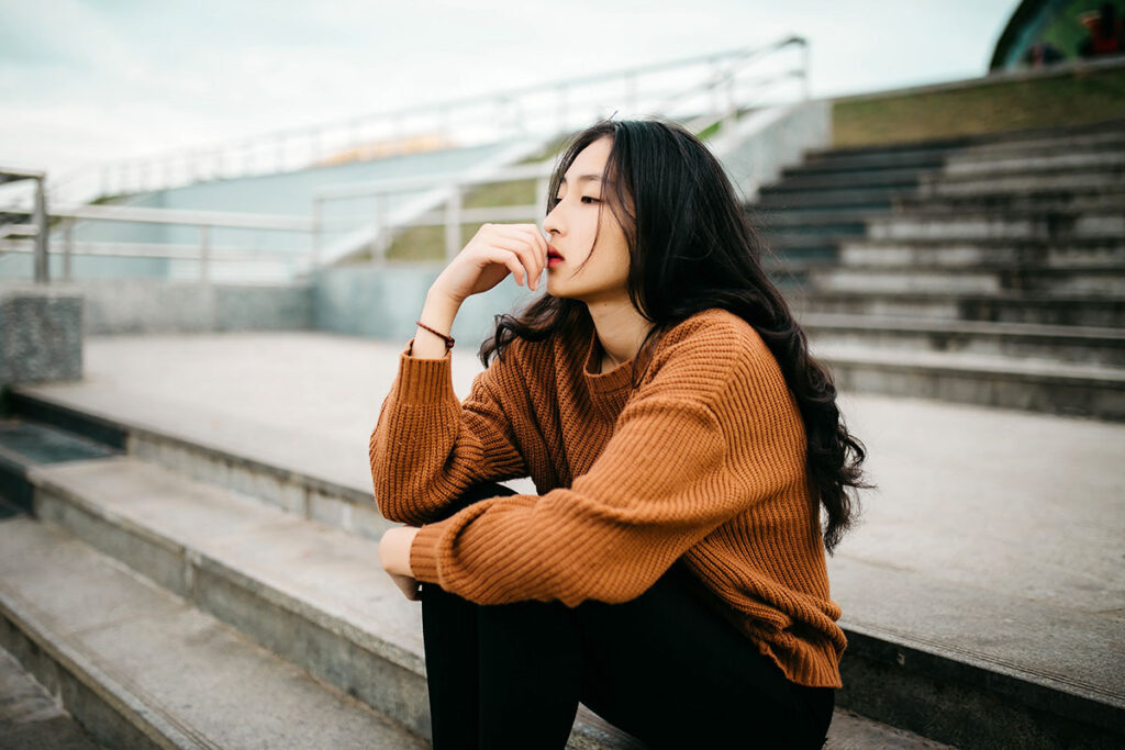 woman pondering forgiving her enemy